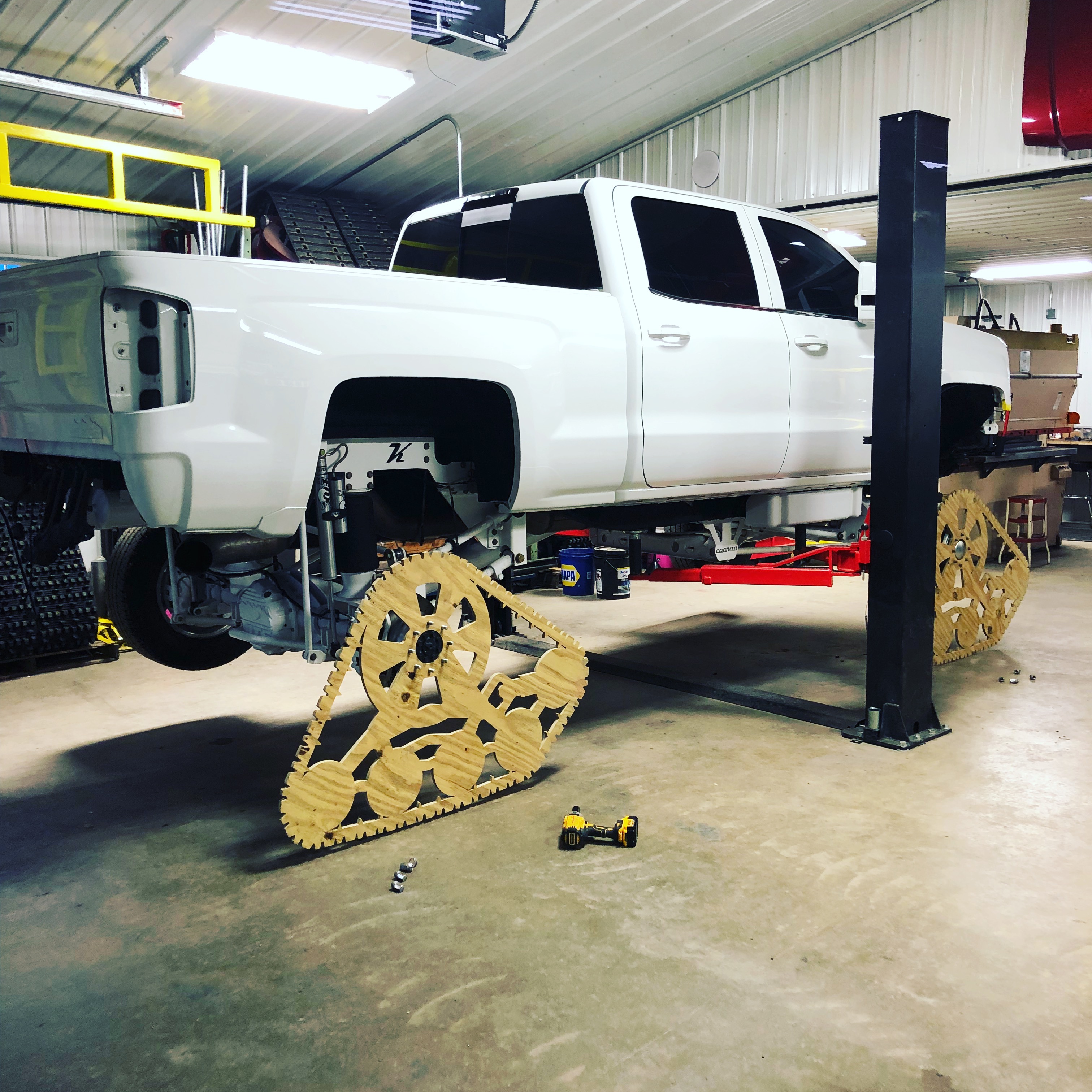 Plywood prototype track on truck in shop